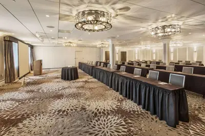 a large room with rows of tables and chairs at DoubleTree by Hilton Nanuet in Nanuet
