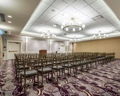 a room with a bunch of chairs in it at Park Manor Hotel in Clifton Park