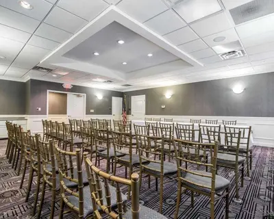a room with a bunch of chairs in it at Park Manor Hotel in Clifton Park