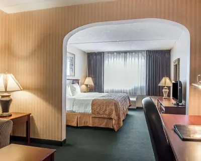 a hotel room with a bed and a window at The Marx Hotel - Downtown - University Area in Oneonta