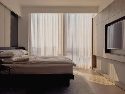 a bedroom with two beds and a flat screen tv at Equinox Hotel New York in New York