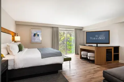 a hotel room with a bed and a television at The Watershed Norwalk in Norwalk
