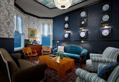 a living room with a couch and a table at Graduate by Hilton New Haven in New Haven