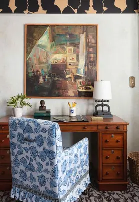 a room with a desk with a chair and a picture at Graduate by Hilton New Haven in New Haven