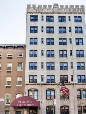 a building with an american flag in front of it at Leo House in New York
