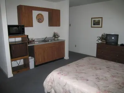 a hotel room with a bed and a sink at Jenny's Country Manor in Stanfordville
