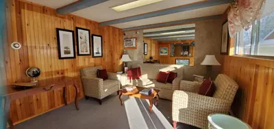 a living room with couches and a table at Red Ranch Inn in Catskill