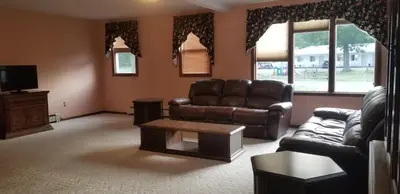 a living room with a couch and a coffee table at Red Ranch Inn in Catskill