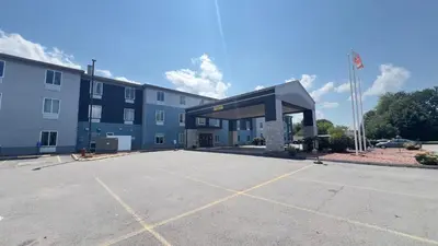 an empty parking lot in front of a building at Best Western Manchester in Manchester