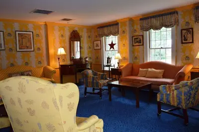 a living room with a couch and chairs at Deerfield Inn in Deerfield