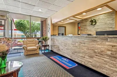 an office with a lobby with a reception counter at Howard Johnson by Wyndham Albany in Albany