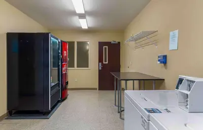 a room with a cocacola machine in a hospital room at Extended Stay America Select Suites - Hartford - Manchester in Manchester