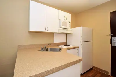 a small kitchen with a sink and a white refrigerator at Extended Stay America Select Suites - Hartford - Manchester in Manchester