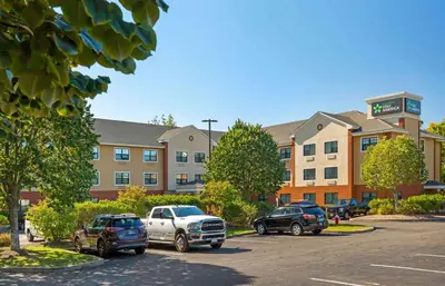 a parking lot in front of a hotel at Extended Stay America Select Suites - Hartford - Manchester in Manchester