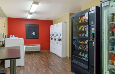 a room with a large refrigerator with drinks in it at Extended Stay America Suites - Hartford - Meriden in Meriden