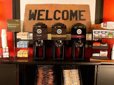 a store with a welcome sign on a counter at Extended Stay America Suites - Hartford - Meriden in Meriden