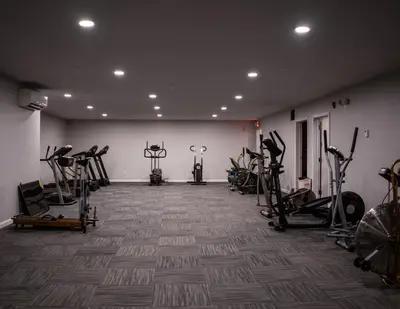 a gym with several treadmills and exercise bikes at Allen Lake Resort Richfield Springs Cooperstown in Richfield Springs