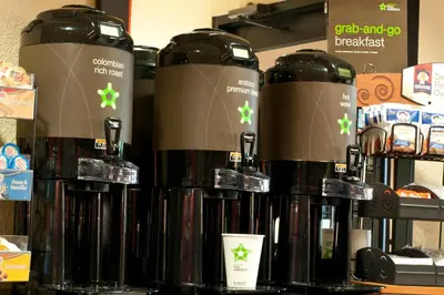 a group of bottles of coffee on a shelf at Extended Stay America Suites - Meadowlands - Rutherford in Rutherford
