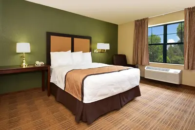 a hotel room with a large bed and a window at Extended Stay America Suites - Meadowlands - Rutherford in Rutherford