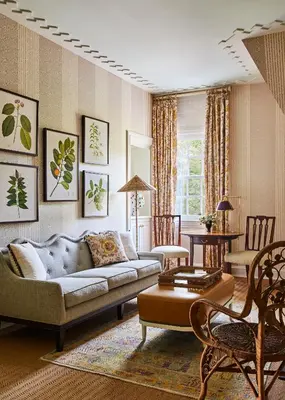 a living room with a couch and a table at The Mayflower Inn & Spa, Auberge Collection in Washington