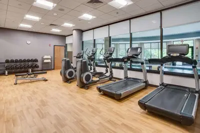 a gym with treadmills and elliptical machines at Hyatt House Hartford North/Windsor in Windsor