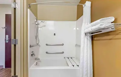 a shower in a bathroom with a white shower curtain at Extended Stay America Suites - Hanover - Parsippany in Whippany