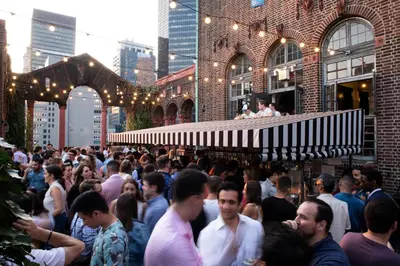 a crowd of people standing outside of a building at Pod 39 in New York