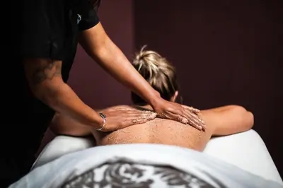 a woman getting a back massage from a man at Mirbeau Inn & Spa, Rhinebeck in Rhinebeck