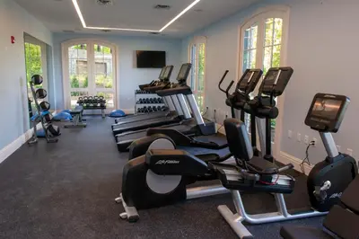 a gym with several treadmills and elliptical machines at Mirbeau Inn & Spa, Rhinebeck in Rhinebeck
