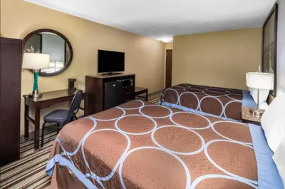 a hotel room with a bed and a desk at FairBridge Inn Express Nyack in Nyack