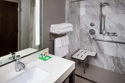 a bathroom with a sink and a shower at Hyatt Place Poughkeepsie - Hudson Valley in Poughkeepsie
