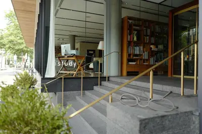 a building with a staircase in front of a library at The Study at Yale, Study Hotels in New Haven