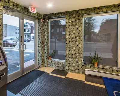 a store front with a wall of windows at Rodeway Inn Belleville in Belleville