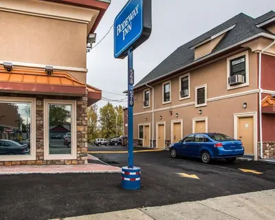 a blue street sign in front of a building at Rodeway Inn Belleville in Belleville