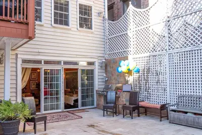 a patio with chairs and a table in front of a building at TOWNHOUSE 222 in New York