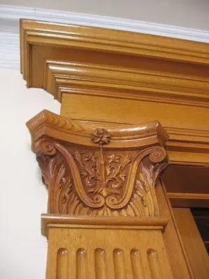 a wooden door with a carving on top of it at Olde Judge Mansion B&B in Troy