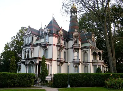 a large house with a tower on top of it at Batcheller Mansion Inn in Saratoga Springs