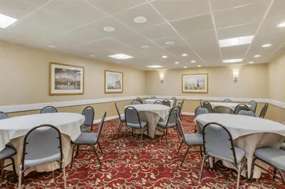 a conference room with tables and chairs in it at Best Western PLUS Morristown Inn-Florham Park in Morristown