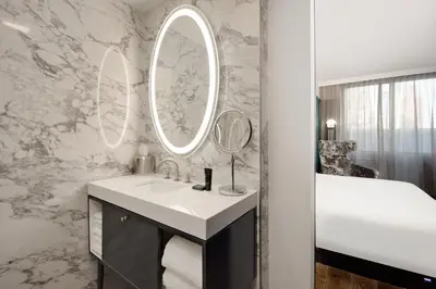 a bathroom with a sink and a mirror at Hyatt Centric Midtown 5th Avenue New York in New York