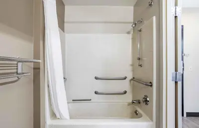 a shower in a bathroom with a tub at Extended Stay America Suites - Shelton - Fairfield County in Shelton
