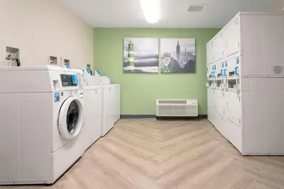 a laundry room with a washer and dryer at Extended Stay America Suites - Shelton - Fairfield County in Shelton