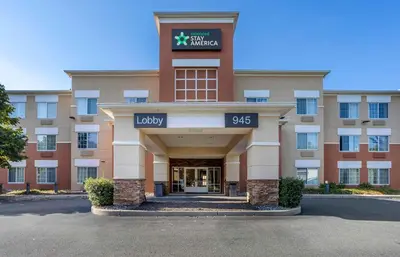 a large building with a sign that reads lucky at Extended Stay America Suites - Shelton - Fairfield County in Shelton
