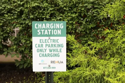a sign that says electric car parking only while charging at Chatham Travel Lodge in Old Chatham