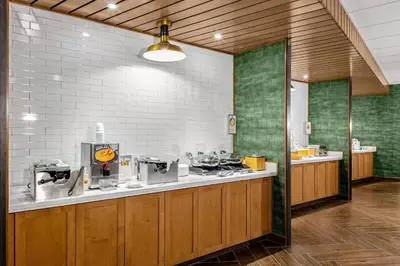 a kitchen with a counter with aasteryasteryasteryasteryasteryasteryasteryasteryastery at Fairfield Inn & Suites by Marriott Queensbury Glens Falls/Lake George in Queensbury