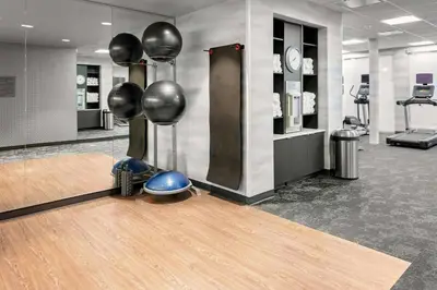 a room with a bowling alley with balls on the floor at Fairfield Inn & Suites by Marriott Queensbury Glens Falls/Lake George in Queensbury