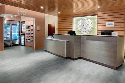 a lobby of a store with a counter and a cash register at Fairfield Inn & Suites by Marriott Queensbury Glens Falls/Lake George in Queensbury
