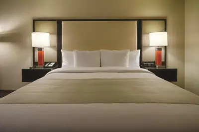 a bedroom with a large bed with two lamps at DoubleTree by Hilton Hotel Bristol in Bristol