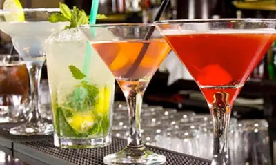 a group of three cocktails sitting on a bar at DoubleTree by Hilton Hotel Bristol in Bristol