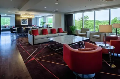 a lobby with couches and a table and chairs at DoubleTree by Hilton Hotel Bristol in Bristol