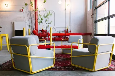 a group of chairs in a room at The Local NY Hostel in Queens